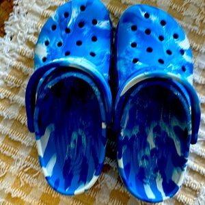 Boys size 6. Multi color blue Crocs.